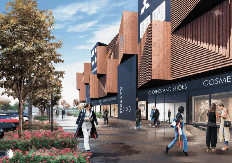 Фасад с витринами и зоной прогулки перед входом: люди, зелень и стильная архитектура местного торгового формата.