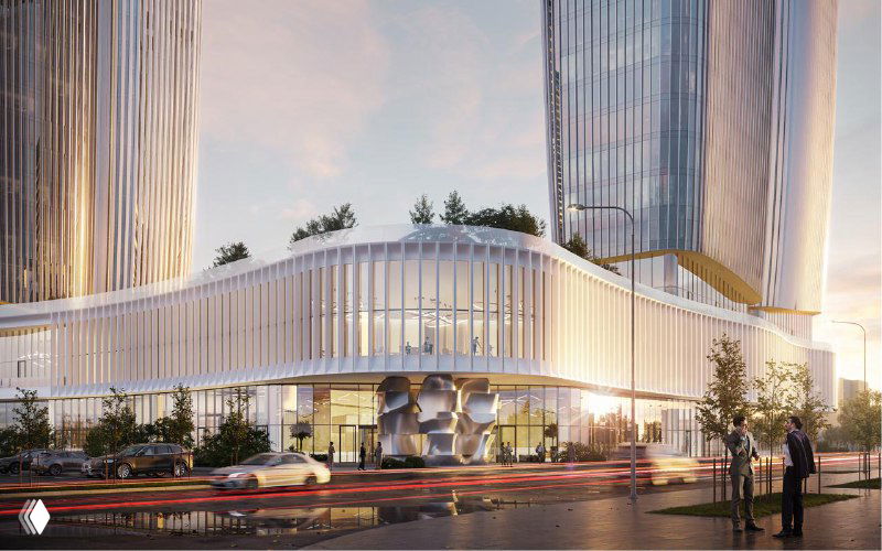 Уличный вид на стилобат и озеленённую территорию у фасада офисного комплекса: ламели, тротуар и автомобили на проезжей части вблизи проекта.