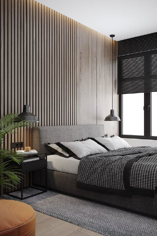 Спальня с изголовьем из вертикальных деревянных панелей, мягкая кровать, тёплые оттенки и аккуратные текстильные детали для уюта.