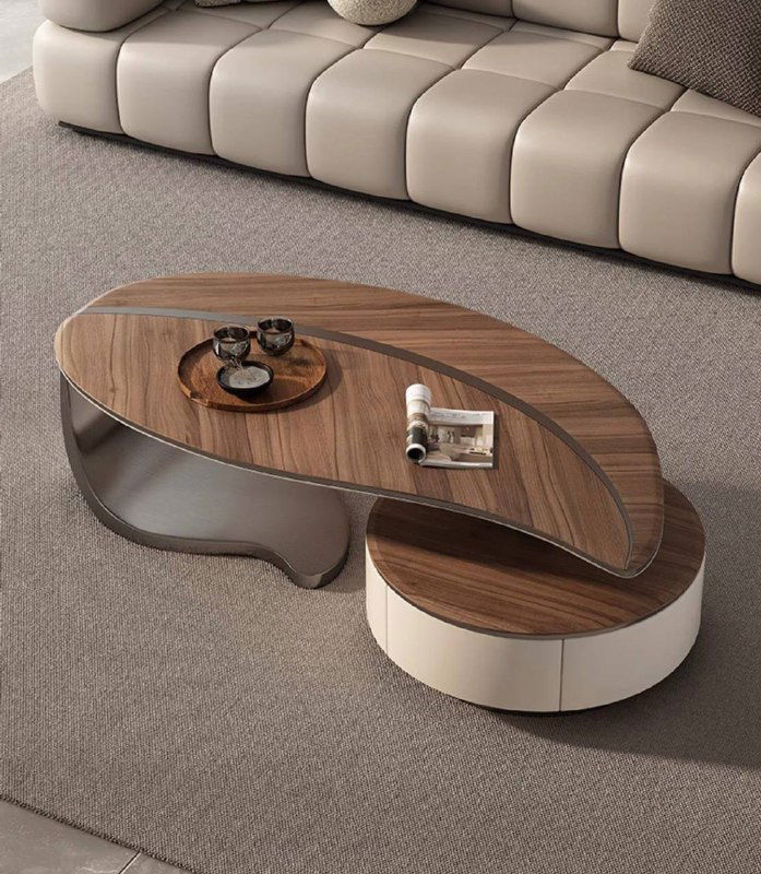 Журнальный столик в интерьере рядом с диваном: сочетание овальных и круглых форм, функциональность и стильный дизайн.