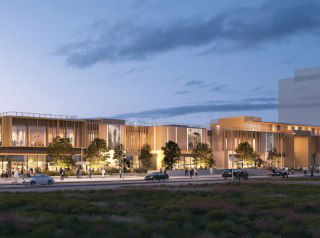 Вечерний вид на современный молл с освещённым фасадом, террасами и зоной для прогулок у входа, архитектурный рендер.