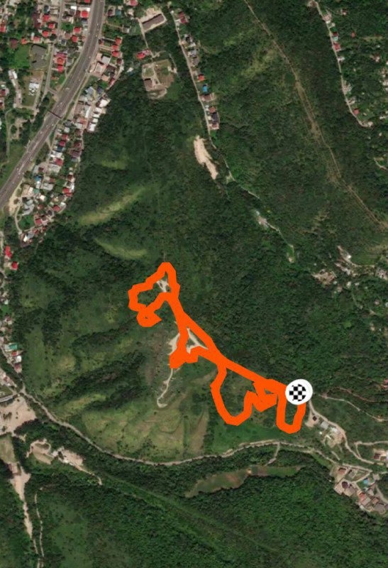 Спутниковый снимок местности в Алмате с оранжевой линией трека Athletex Race, показан маршрут круга и пиктограмма точки старта/финиша.