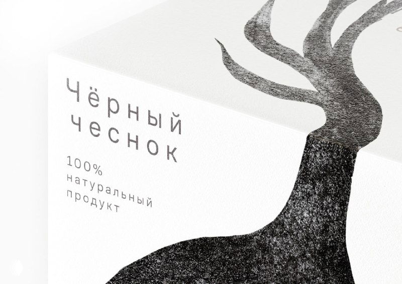 Упаковка чёрного чеснока с мистическими иллюстрациями