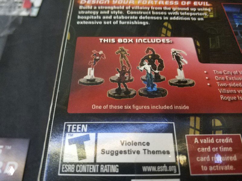 Фрагмент упаковки с подписью 'This box includes', изображением миниатюр и знаком рейтинга ESRB Teen — деталь содержания и маркировка.