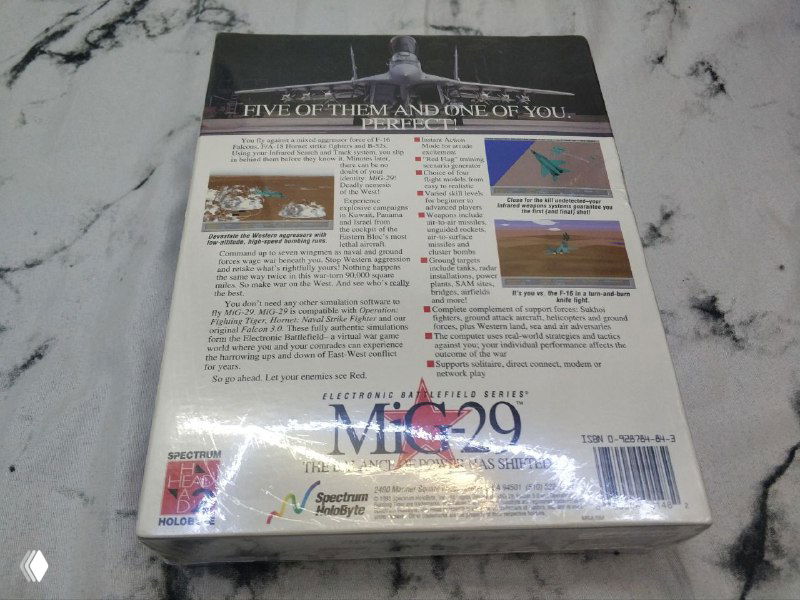 Задняя сторона коробки MiG 29 с описанием игры и скриншотами на светлой мраморной поверхности, упаковка целая