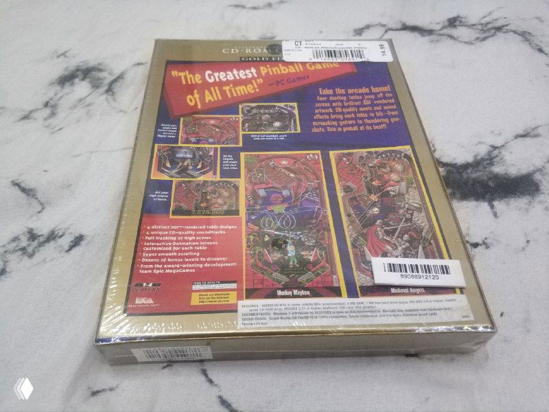 Задняя сторона Extreme Pinball: видны описание, скриншоты и наклейки продавца на запечатанной коробке на мраморе.