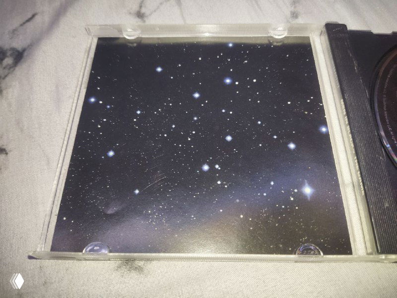 Фото внутренней стороны джевела Men in Black: вставка с изображением звёздного неба, без скриншотов и дополнительной информации