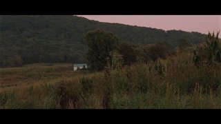 Широкий кинематографический кадр из видео-ролика кампании ChatGPT: пейзажная сцена с домом на заднем плане, атмосферный визуал и градация цветов