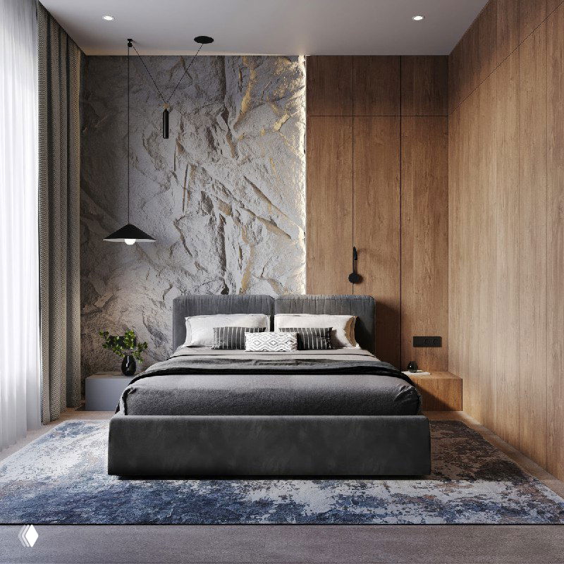Фронтальный вид на кровать и стену с текстурой «под скалу», большая декоративная ковровая дорожка и баланс светлых и тёмных материалов в интерьере спальни.