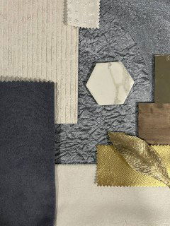 Детальный снимок образцов отделки и текстиля: сочетание нейтральных и золотистых оттенков, металлические и текстильные акценты проекта.