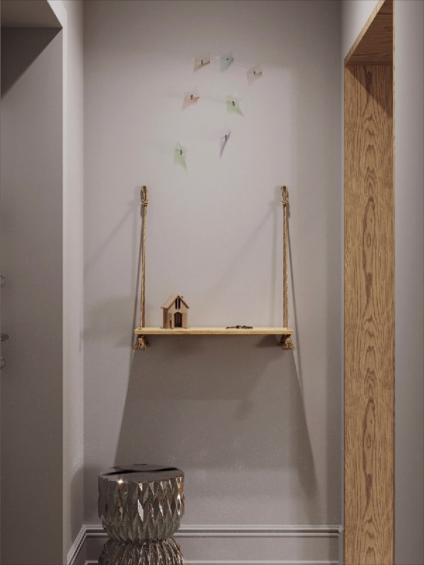 Узкая ниша прихожей с подвесной полкой и декоративными элементами на белой стене, мягкое освещение подчёркивает минималистичные акценты и вертикальную композицию.