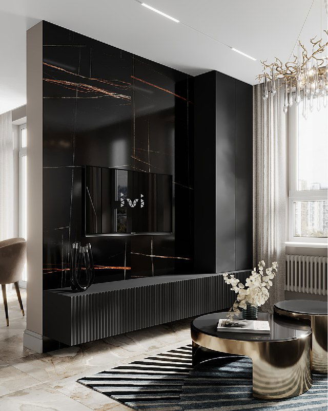 Чёрная стена из крупного керамогранита с золотыми прожилками, мебельная композиция для хранения и незаметный телевизор в интерьере гостиной проекта.