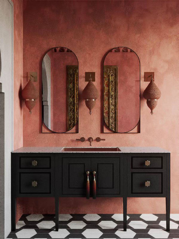 Умывальная зона в тёплых терракотовых тонах с чёрной тумбой и парой овальных зеркал, атмосфера винтажной элегантности и декоративных светильников.