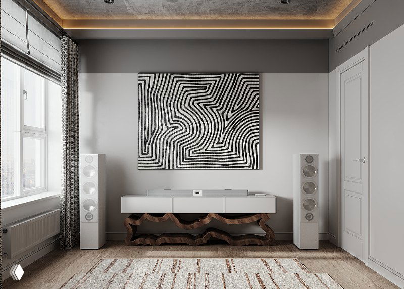 Кинозона напротив дивана: акустические колонки по бокам, консоль под экраном и крупное абстрактное панно на светлой стене.