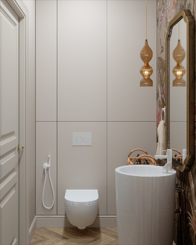 Фронтальный вид санузла: подвесной унитаз и раковина, на стене незаметные фасады для хранения и панель для коллекторной системы.