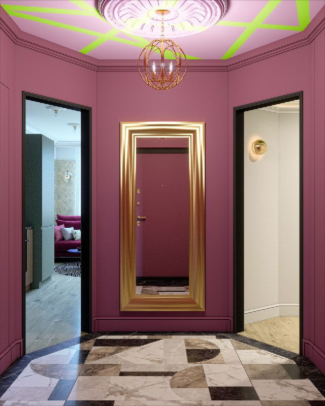 Узкое прямоугольное зеркало в золотой раме в ярко-розовом холле с мраморным полом, отражение дверного проема и прихожей за ним.