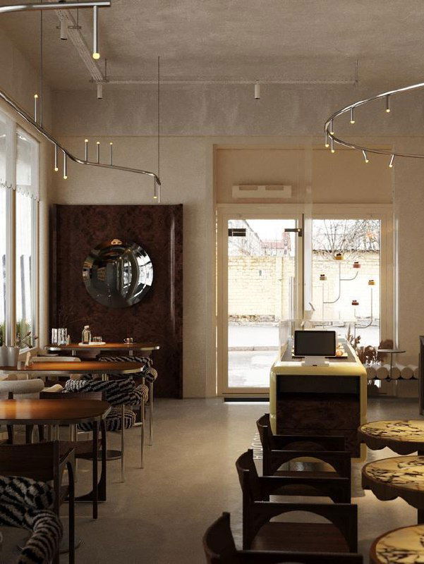 Светлое кафе с минималистичным интерьером, деревянными столами и большими окнами — много естественного света и простая мебель.