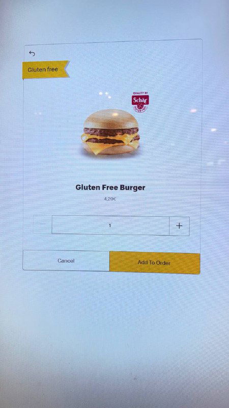 Экран меню McDonald's: изображение безглютенового бургера на светлом фоне, промо-плитка с подписью Gluten Free и макет интерфейса заказа.