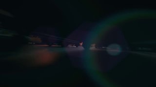 Темная превью‑кадра видео с выраженной линзовой засветкой и расплывчатыми силуэтами — превью неофициальной CGI‑рекламы KFC, созданной с помощью ИИ и визуальных эффектов.