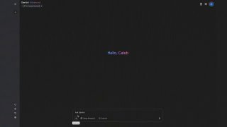 Тёмный экран приложения с приветственной надписью «Hello, Caleb» и мини-панелью внизу — пример тёмной темы и области предпросмотра кода/результата.