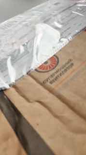 Фото упаковки и деталей оборудования: картонная коробка с упаковочной лентой, предпросмотр видео о пылесосе MAX Ultimate X2 и демонстрации работы.