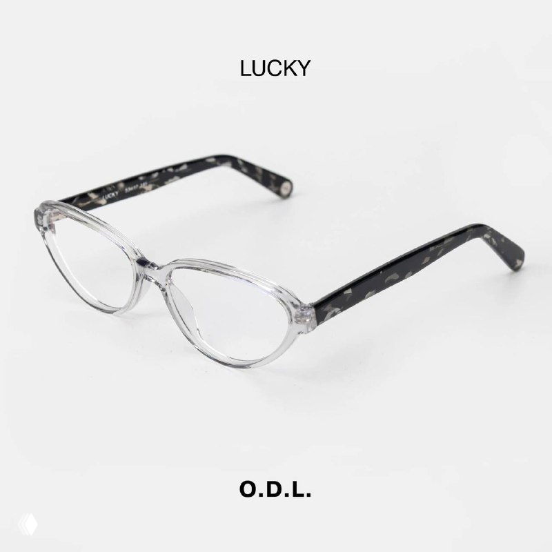 Оправa LUCKY (O.D.L.) на белом фоне: светлый прозрачный фронт и тёмные дужки с мраморным узором, товарная студийная съёмка.
