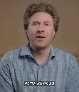 Close-up portrait of a man speaking on camera in a checked shirt against a neutral background; video preview for Placy AI post.