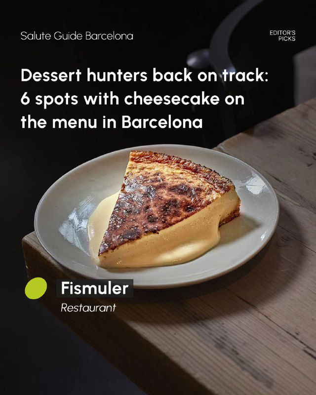 Triangle slice of cheesecake with a caramelized top on a plate, photographed on a wooden table inside a Barcelona restaurant.