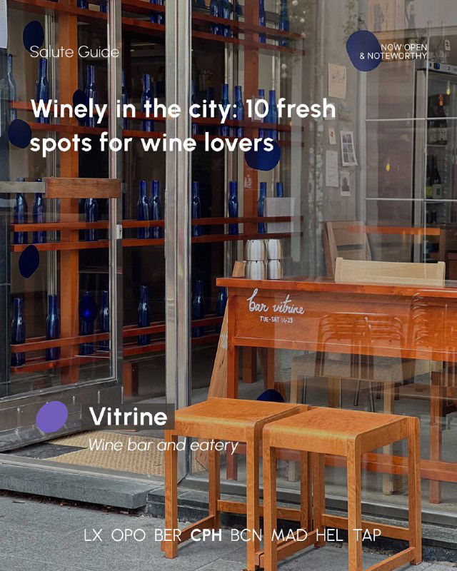 Exterior view of a wine bar with wooden stools and a storefront window, daytime shot suggesting a friendly local wine and eatery space.