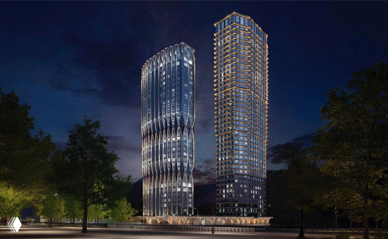 Ночной рендер ЖК A22: две башни подсвечены, подчеркнуты высотные силуэты на фоне тёмного неба и городских огней.