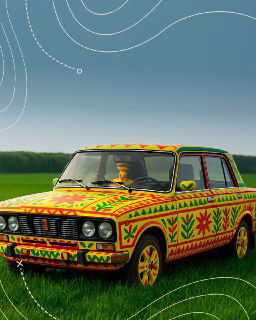 Ретро‑автомобиль полностью расписан в узорах филимоновской росписи: солнца, елочки и декоративные геометрические мотивы на ярком кузове.