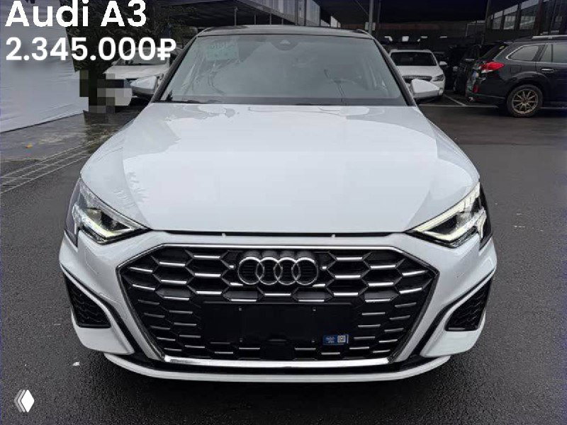 Фронтальный вид белого Audi A3 35TFSI Sportback 2022 года; на фото указана цена 2.345.000₽ и чистый кузов без окрасов.