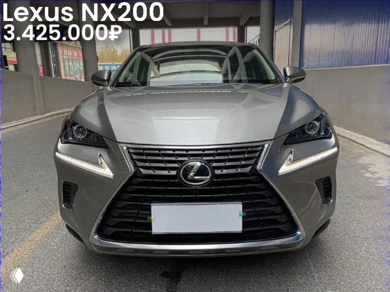 Фронтальный кадр Lexus NX200 в туннеле/гараже, серебристый кузов, видна фирменная решётка радиатора, фары и общий вид передней части авто.