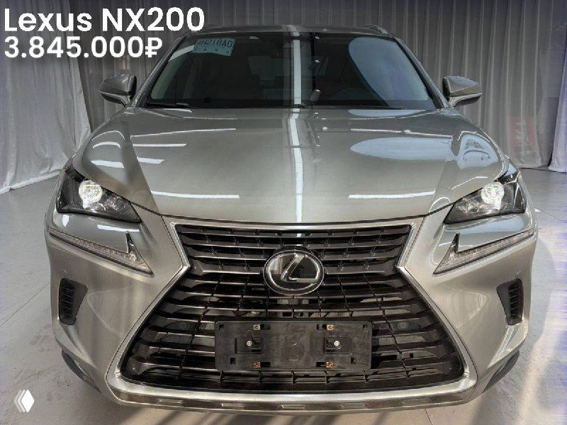 Фронтальное фото серебристого Lexus NX200 в ангаре; хорошо видна фирменная решётка, указаны пробег 29 000 км и цена 3.845.000₽