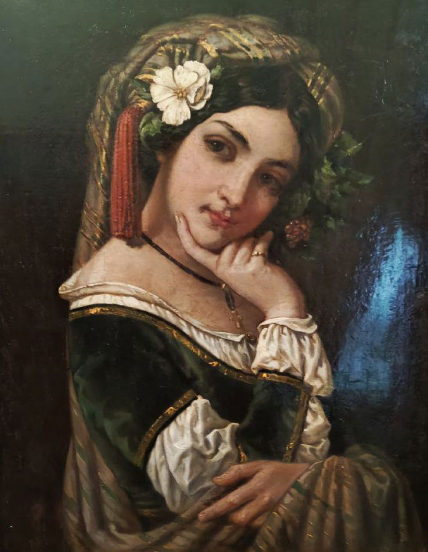 Живописный портрет молодой женщины XIX века в традиционной рамке — одна из картин в галерее дворца, портретное искусство.