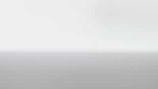 Студийный рендер на сером фоне с маленькой ромбовидной эмблемой в углу; презентационный кадр из пакета визуальных материалов проекта айдентики Tugg.