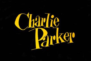 Жёлтая декоративная леттеринговая надпись «Charlie Parker» на тёмном фоне — образец оригинальной типографики для джазовых афиш.