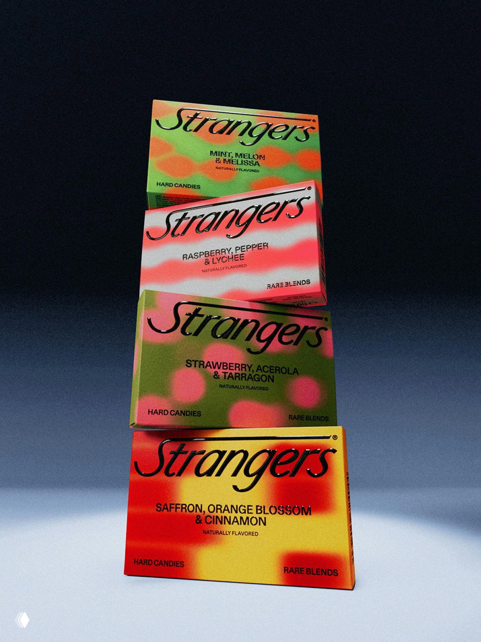Стек из нескольких коробок Strangers вертикально; разноцветные размытые паттерны для разных вкусов и тёмный нейтральный фон студийной съёмки.