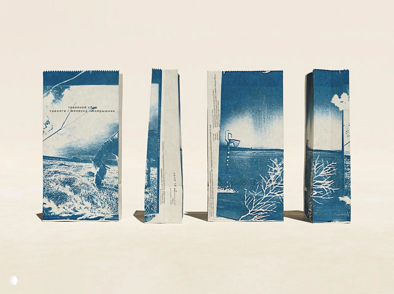 Четыре прямоугольные картонные упаковки с изображениями природного пейзажа, расположенные вертикально на светлом фоне.