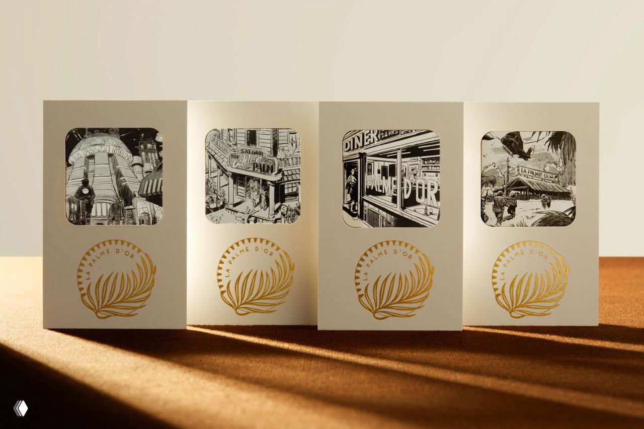 Ряд карточек с чёрно-белыми иллюстрациями и золотым тиснением пальмовой ветви: элементы фирменного набора — иллюстрации, купоны и логотип на светлой бумаге.