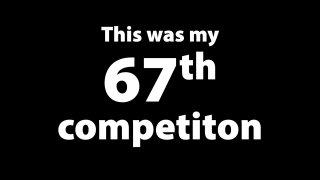 Кадр из видео: белый текст на чёрном фоне «This was my 67th competiton», титр, связанный с участием в соревновании по сборке кубика Рубика.
