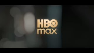 Кадр из тизера: золотой логотип HBO Max на размытом тёмном фоне, заставка первого трейлера сериала «Гарри Поттер».