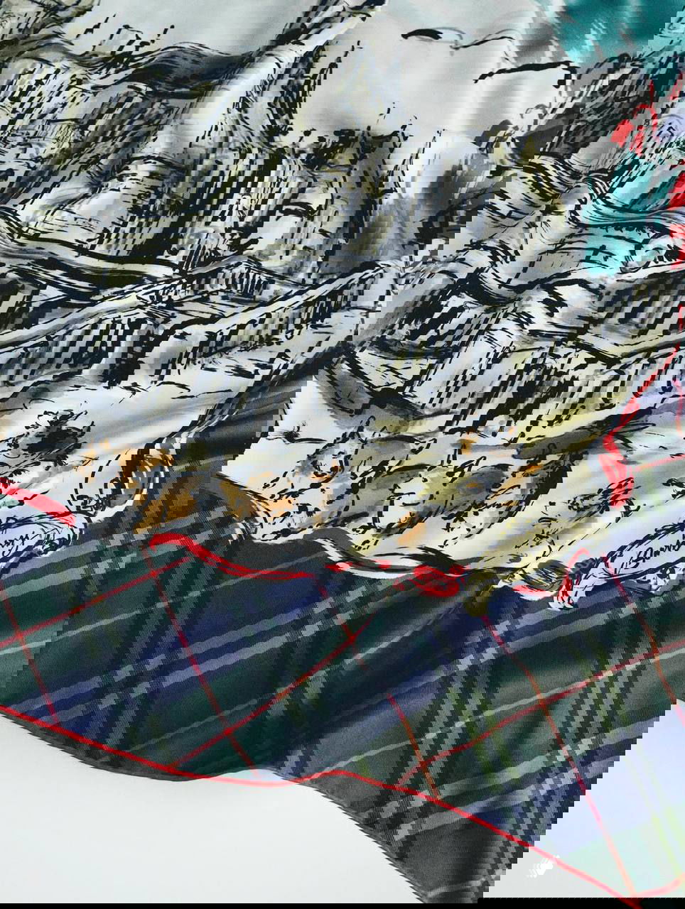 Фрагмент шелкового платка Burberry с иллюстрацией замка Балморал и рядом маленьких корги по краю, тартановая окантовка.