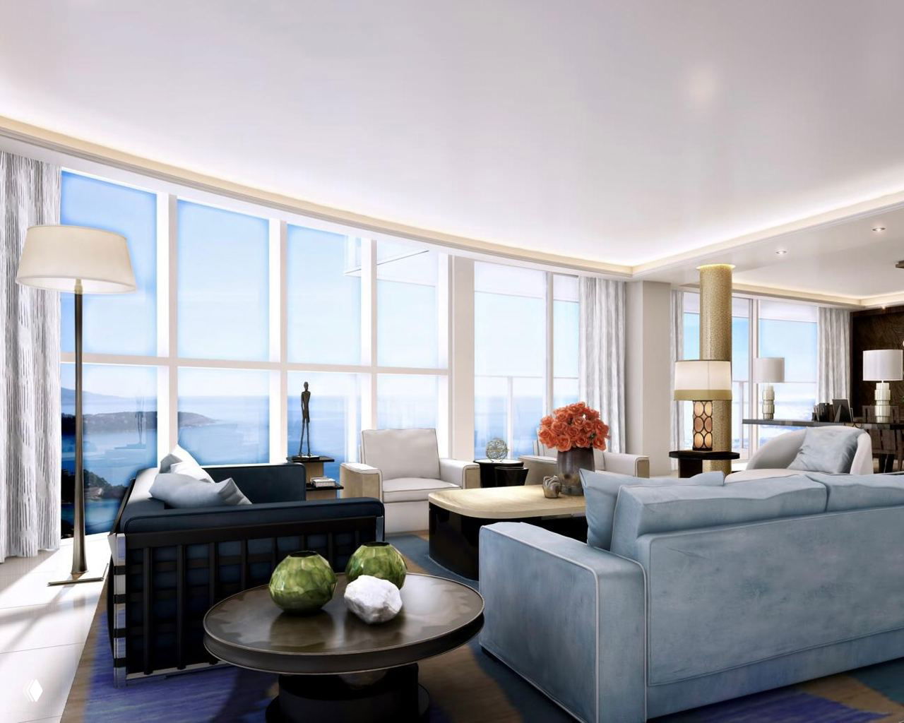 Просторная гостиная пентхауса с панорамными окнами, светлой мебелью и декоративными элементами; вид на море через крупное остекление.