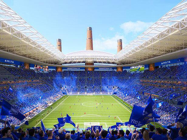 Интерьер трибун и поле стадиона во время матча, показывающий акустическую модель и атмосферу с болельщиками в синем.