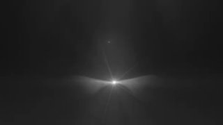 Чёрно-белое абстрактное изображение: светящаяся точка в центре с лучами на тёмном фоне, символизирующее одиночество и надежду.