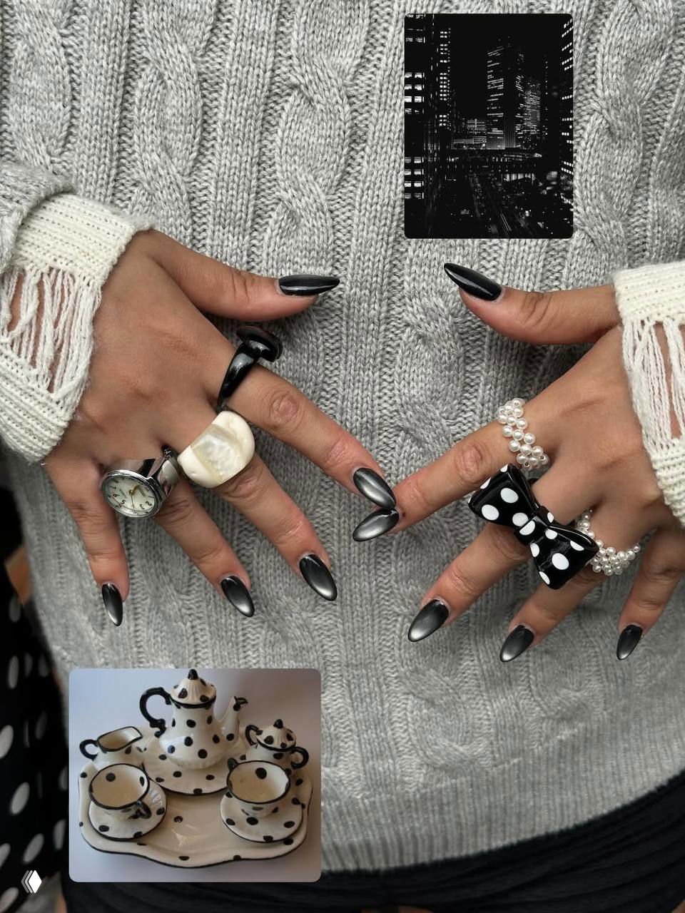 Длинные глянцевые чёрно‑сталиновые ногти с металлическим отблеском, многие кольца и жемчужные акценты на фоне тёплого вязаного свитера и нейтрального окружения.