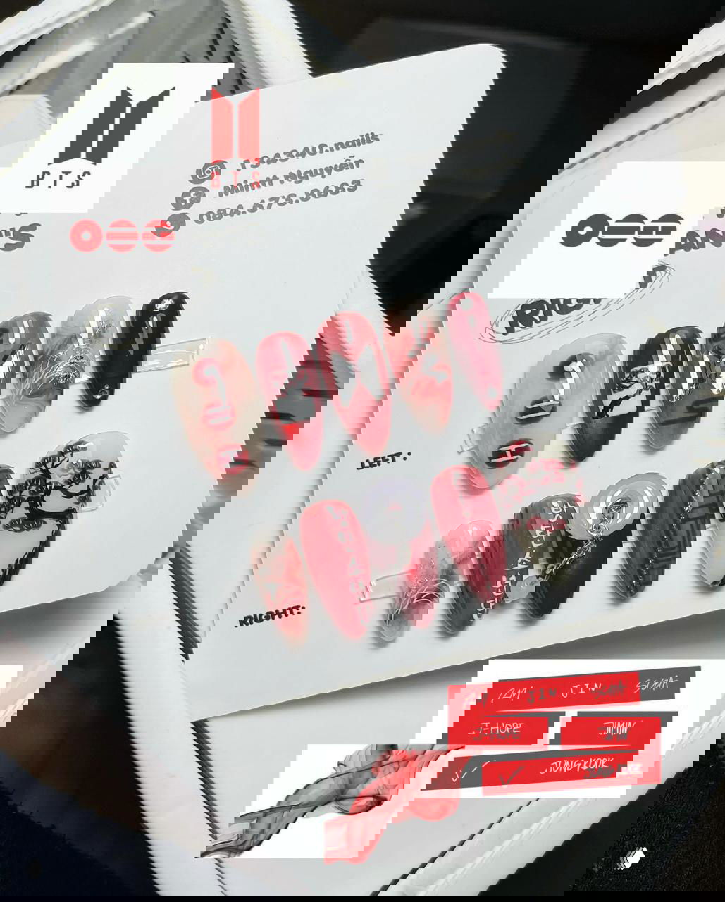 Набор накладных ногтей с красно‑белыми дизайнами, корейскими орнаментами и буквами — пример кастомного маникюра для фанатов BTS.