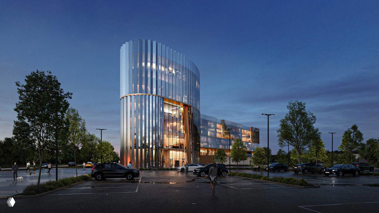 Рендер ночного времени: освещённый корпус спортивного центра, парковка на переднем плане и приглушённая окружающая зелёная зона.