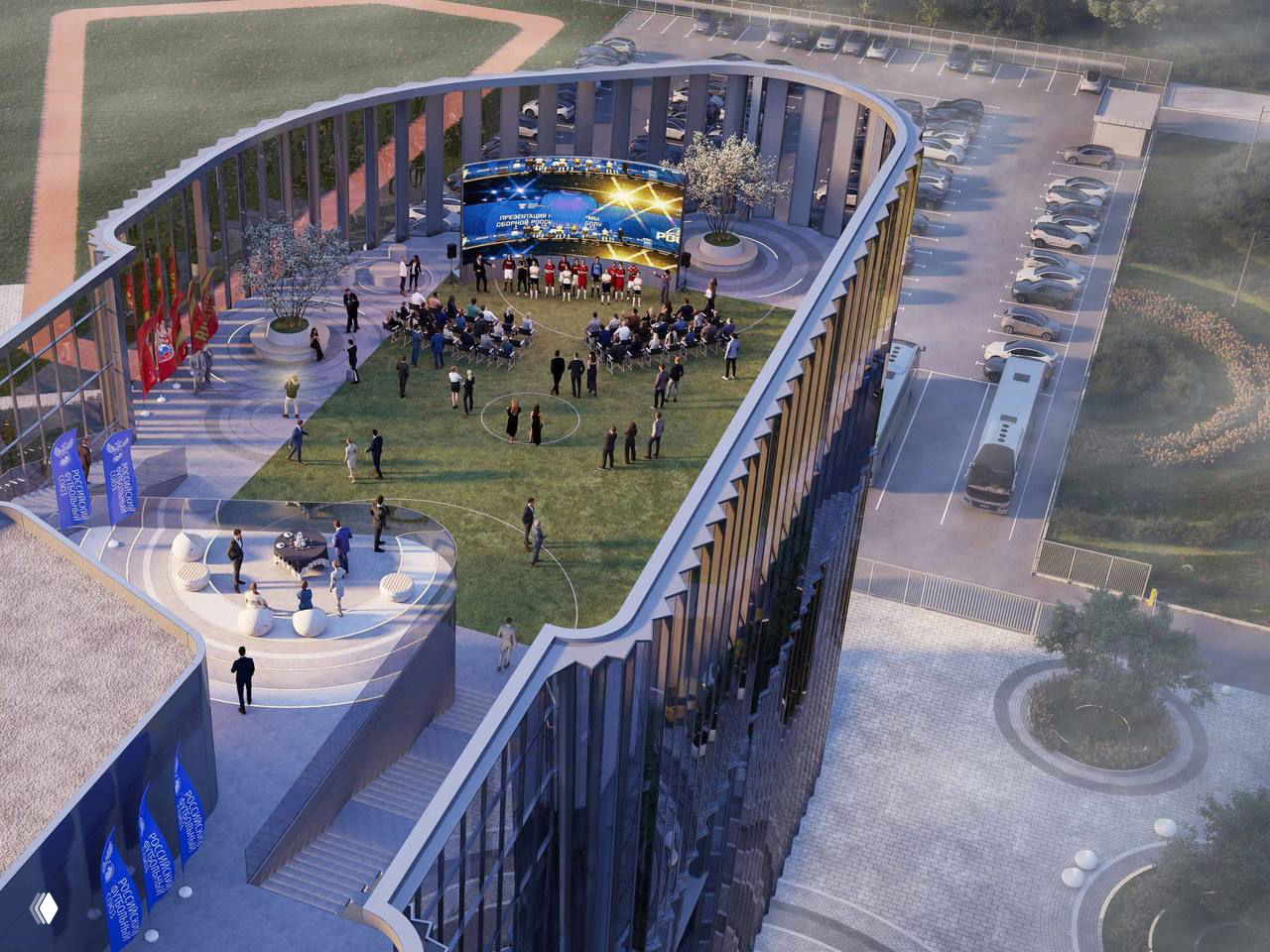 Аэровид сверху: внутренняя крытая площадка и терраса комплекса, мероприятие на крыше, люди и сцена в центре внутреннего двора.